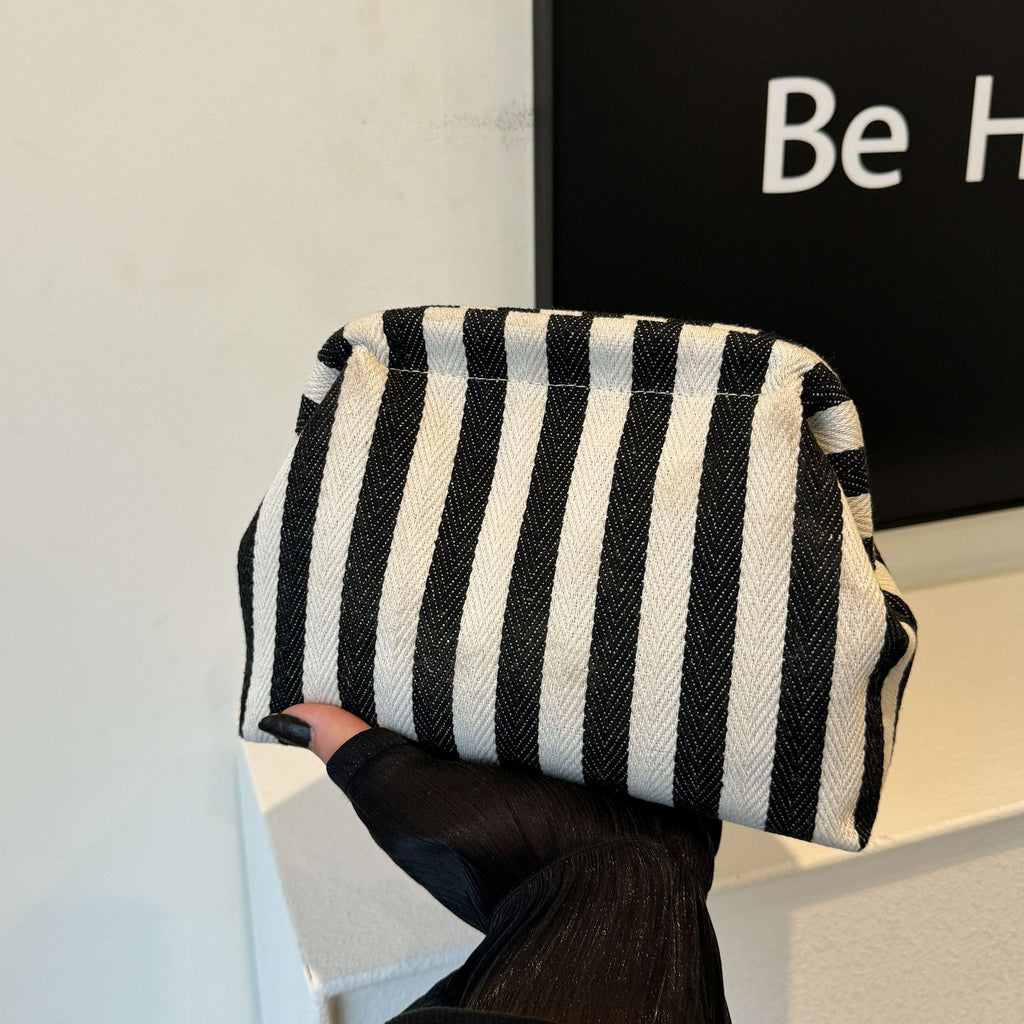 Striped women's handbag with vertical stripes and contrasting color shell bag