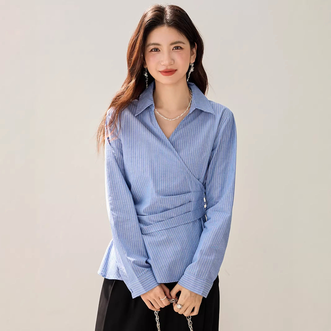 Spring blue and white striped long sleeved shirt for women with a cinched waist design, featuring a versatile layering and slimming style