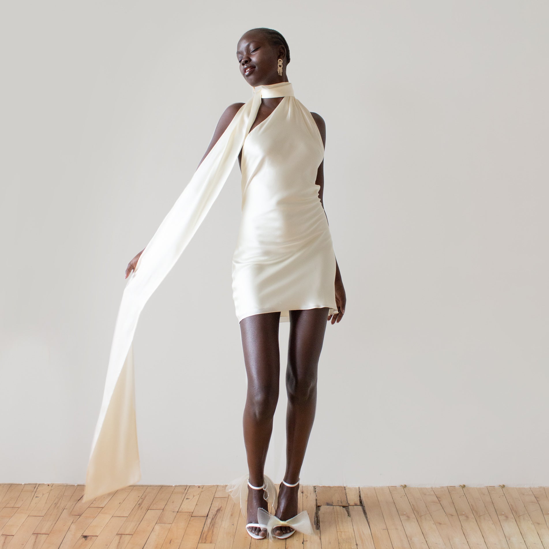 New dress with a feminine feel, featuring a backless short skirt and an adjustable neck hanging satin dress