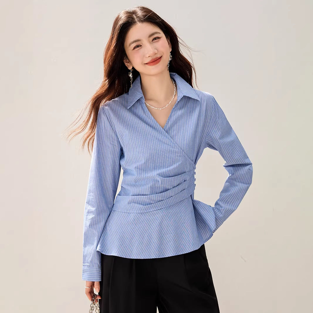 Spring blue and white striped long sleeved shirt for women with a cinched waist design, featuring a versatile layering and slimming style