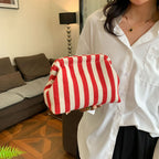 Striped women's handbag with vertical stripes and contrasting color shell bag