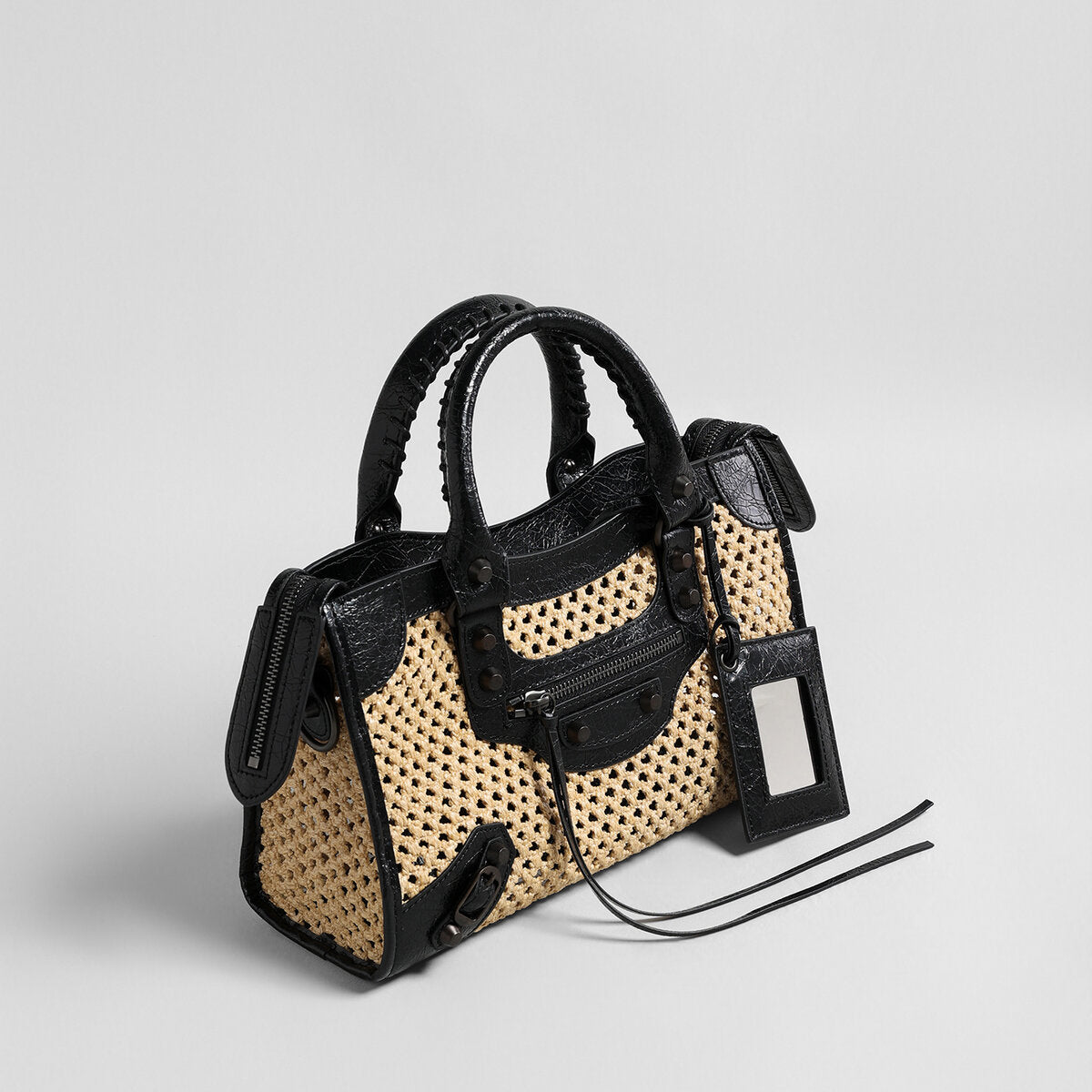 Studded Woven Straw Moto Bag – Edgy Leather Trim Crossbody with Dual Straps