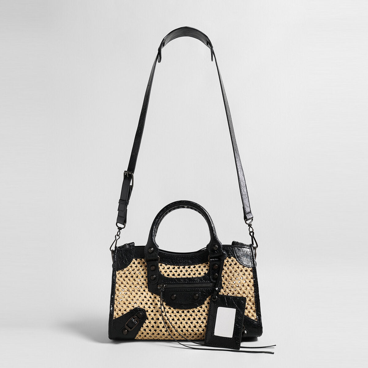 Studded Woven Straw Moto Bag – Edgy Leather Trim Crossbody with Dual Straps